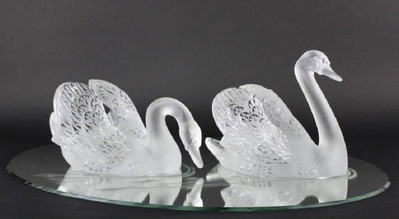 PAIR of Lalique Crystal Art Glass Swans w/ Mirror: Beautiful pair of large Lalique Crystal " Miroir Cygnes " Swans Centerpiece. Sculptures are crafted of fine quality frosted French art glass. Swans are resting on a etched oval shape mirror plateau.