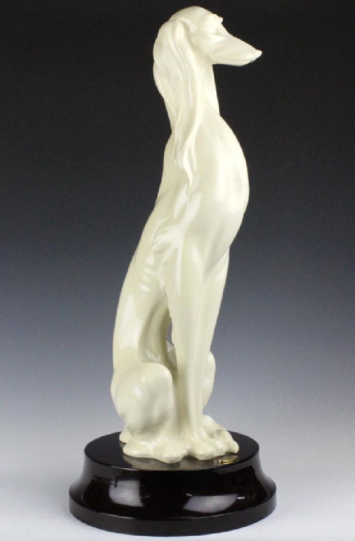 Giuseppe Armani Saluki Hound Dog 2071L Statue 23": Large sculpture figurine by Giuseppe Armani. Titled Saluki Hound, model number 2071L. Made in Italy. Features a regal seated long haired dog on a round brown base. Measures approximately 23 1/2" in he