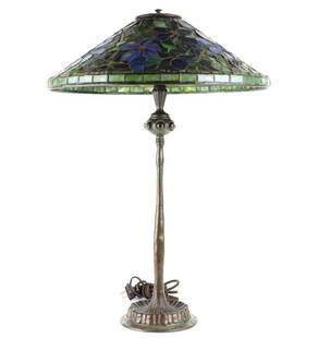 Tiffany Studios Stained Glass Clematis Lamp RARE: Tiffany Studios stained glass table lamp. Clematis floral design in blue and white. Bronze base with inset iridescent "jewels" Three socket top. Base signed TIFFANY STUDIOS NEW YORK 9967. Shade marked