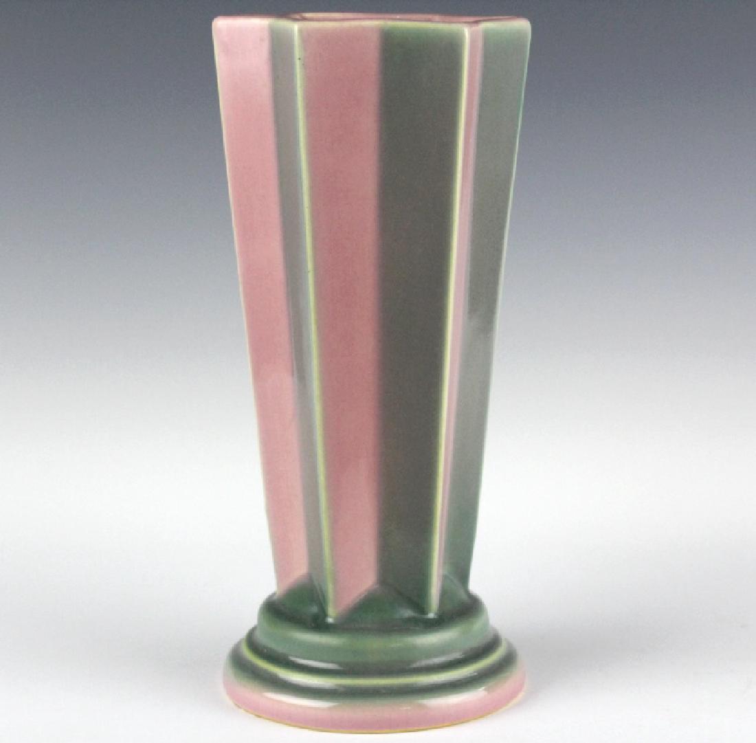 Roseville FUTURA Pleated Shooting Star Vase 385-8: Roseville American art pottery Futura shooting star vase. Features a six pointed star design with stepped circular base. Decorated with pink and gray glaze. Unsigned. Measures 8" tall. Good overall co
