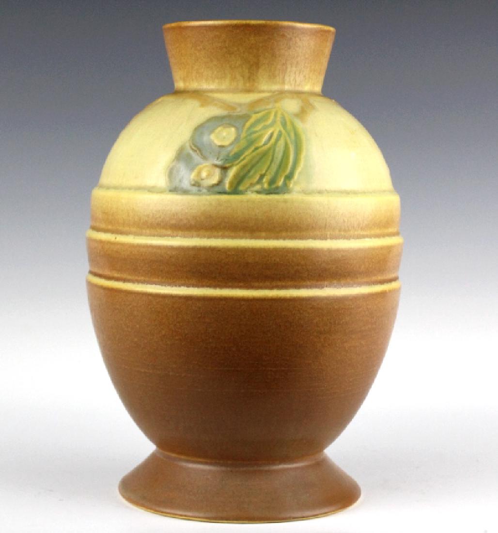 Roseville Pottery FUTURA Egg w/ Leaves Vase 428-8: Roseville American art pottery Futura egg vase with leaves. Features an egg like shape with raised floral decoration. Base unsigned. Measures 8" tall. Good overall condition with repair to base. Featu