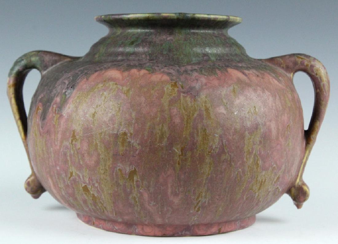 Roseville Art Pottery CARNELIAN II 6" Vase 333-6: Roseville American art pottery Carnelian II vase. Features a layering of pink and purple glaze on a bulbous, squat, form with scrolled handles. Unsigned. Measures 6" tall by 9.5" wide. Good overall co
