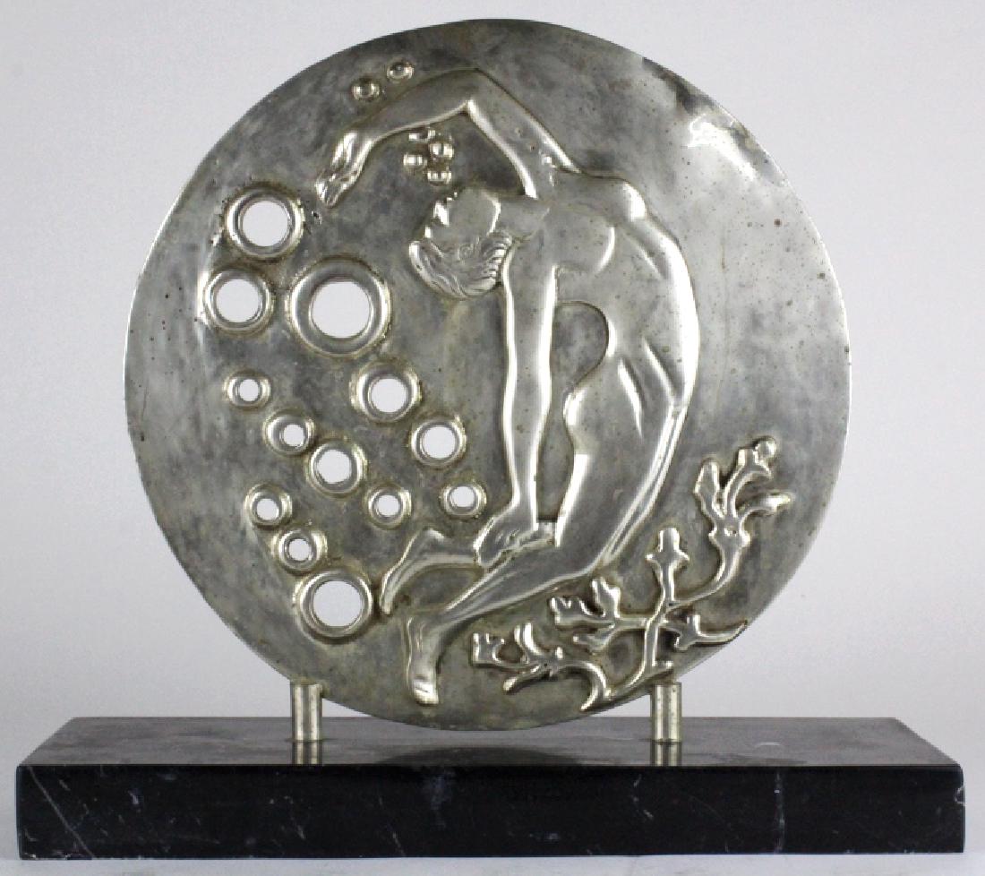 ART DECO Silvered Bronze Nude Disc Sculpture 14": Art Deco Style Disc Sculpture. Crafted of fine quality silvered bronze metal mounted to a black marble base. Depicts a reclining nude female figure with pierced circular design. Sculpture measures app