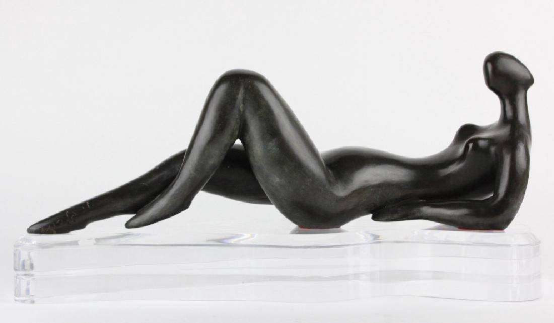 MYSTERY ARTIST Modernist Female Nude Bronze Statue: Features a reclining female nude in the mid century modern Israeli style. Crafted of cast bronze with a greenish brown patina. Signed with initials and limited edition number 5/25 on foot. Comes with 