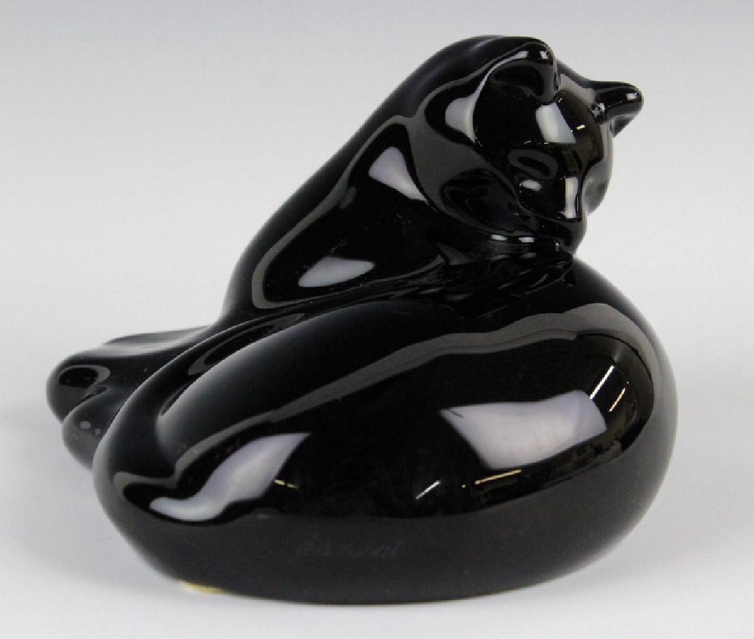 Baccarat French Crystal Black Cat Grooming Figure: Baccarat grooming cat figurine. Crafted of jet back French art glass. Marked Baccarat on base. Measures 3" tall and 4 1/2" wide. Good overall condition with 5mm scratch on body. In house continental U