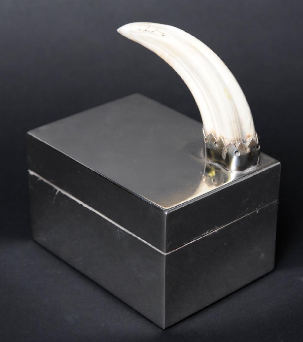 Signed Redmile London Boars Tooth Silver Plate Box: Crafted of fine quality English silver plate. Features a modernist design with clean lines and top set with boars tooth. Signed Redmile London. Measures 6" x 5" x 3 1/2" Good condition with mild surfa