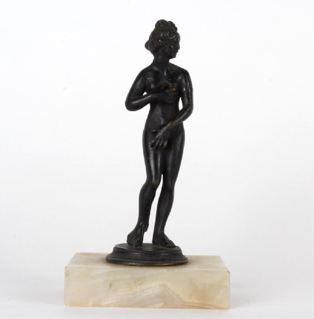 2nd Century AD Bronze Roman Venus Sculpture & Base: Antique Roman bronze Venus goddess sculpture. Crafted of solid bronze. Features the form of a nude Venus. Fixed to a marble base. Measures 5 1/2" tall, not including base. Base measures 2 1/2" x 3 1/2