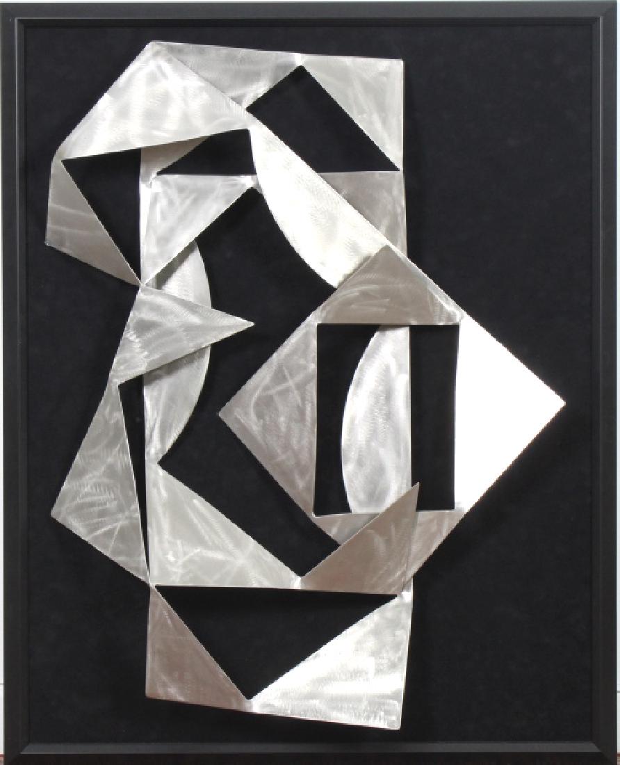 Mystery Artist Modernist Abstract Steel Sculpture: Crafted of steel with a brushed finish. Mounted to black velvet lined frame. Overall dimensions 46" x 35 1/2" x 5". Good condition with mild wear to frame. Will not ship. Will refer a local shipper.