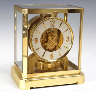 Jaeger Le Coultre Atmos Gold Case Mantle Clock: Jaeger-LeCoultre Atmos clock. Rectangular gilt brass mantel clock wound by barometric pressure changes. Glazed on five sides. 329,XXX serial number. Good condition with surface scratches on