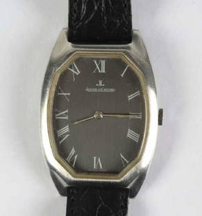 Unusual Vintage Jaeger LeCoultre Mens Wristwatch: Authentic Jaeger LeCoultre men's wristwatch. Stainless steel case and buckle. Unusual elongated octagonal toneau shape case with smooth stepped lugs. Gunmetal gray face with white Roman numeral