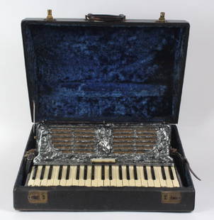 Fine Italian Made 41 Key Accordion w/ Hard Case: Working vintage accordion with case. Features 41 piano keys and a series of base buttons. Housed in an iridescent silver plastic case. The accordion comes in a fitted fabric lined case. Measures