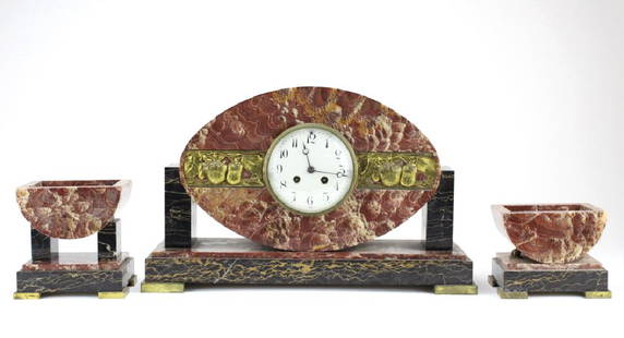 C.H. Paris French Marble Clock w/ Garnitures Set: Marble mantle clock with garnitures. Features a mechanical movement in a red and black marble house. Embellished with a panel of gilt brass strawberries and brass fittings. The clock comes with