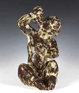 Royal Copenhagen Boy Eating Grapes 13" Figurine: Crafted of fine quality Danish stoneware. Designed by Knud Kyhn for Royal Copenhagen. Number 20501. Features a Faun eating grapes. Amazing glaze. Signed with the Royal Copenhagen three waves mark.