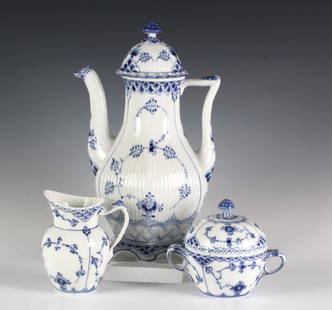 Royal Copenhagen 3 Pc Coffee Set Pot Creamer Sugar: Crafted of fine quality Danish porcelain. Features the Blue Fluted Full Lace pattern. Lot contains: 8 7/8" 6 cup coffee pot with lid, 4 3/4" handled creamer and 4 1/2" double handled lidded sugar bowl