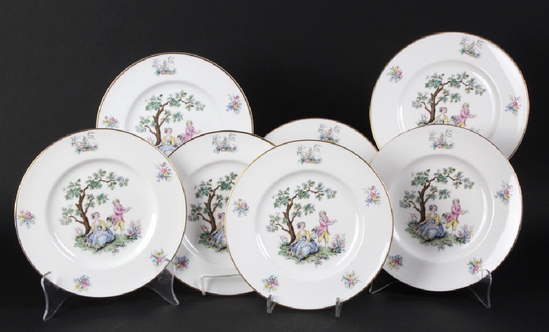 12 Royal Worcester Porcelain Watteau Dinner Plates: Crafted of fine quality English Bone China porcelain. Set of 12 luncheon plates features the Watteau pattern with hand painted colors. Signed with the Royal Worcester back stamp. Each plate measures 9