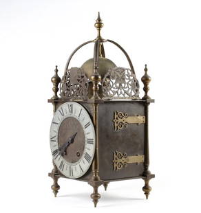 Antique Tiffany & Co French Brass Lantern Clock: 19th century with movement by M Corpet France. Features ornate pierced and engraved floral brass filigree with bell top. Strap style case decoration with Roman numeral dial. Face signed Tiffany & Co.