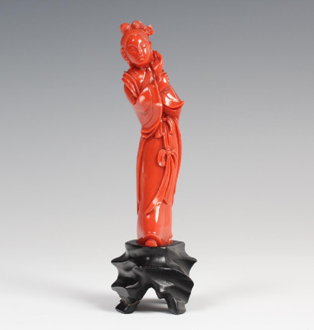 Chinese Carved Deep Red Coral Quan Yin Sculpture: Fine Chinese carved natural salmon pink red branch coral figurine. Depicts the statue form of Quan Yin (Guanyin, Guan Yin, Kuan Yin) crafted from deep red natural coral with flecks of white. Measures