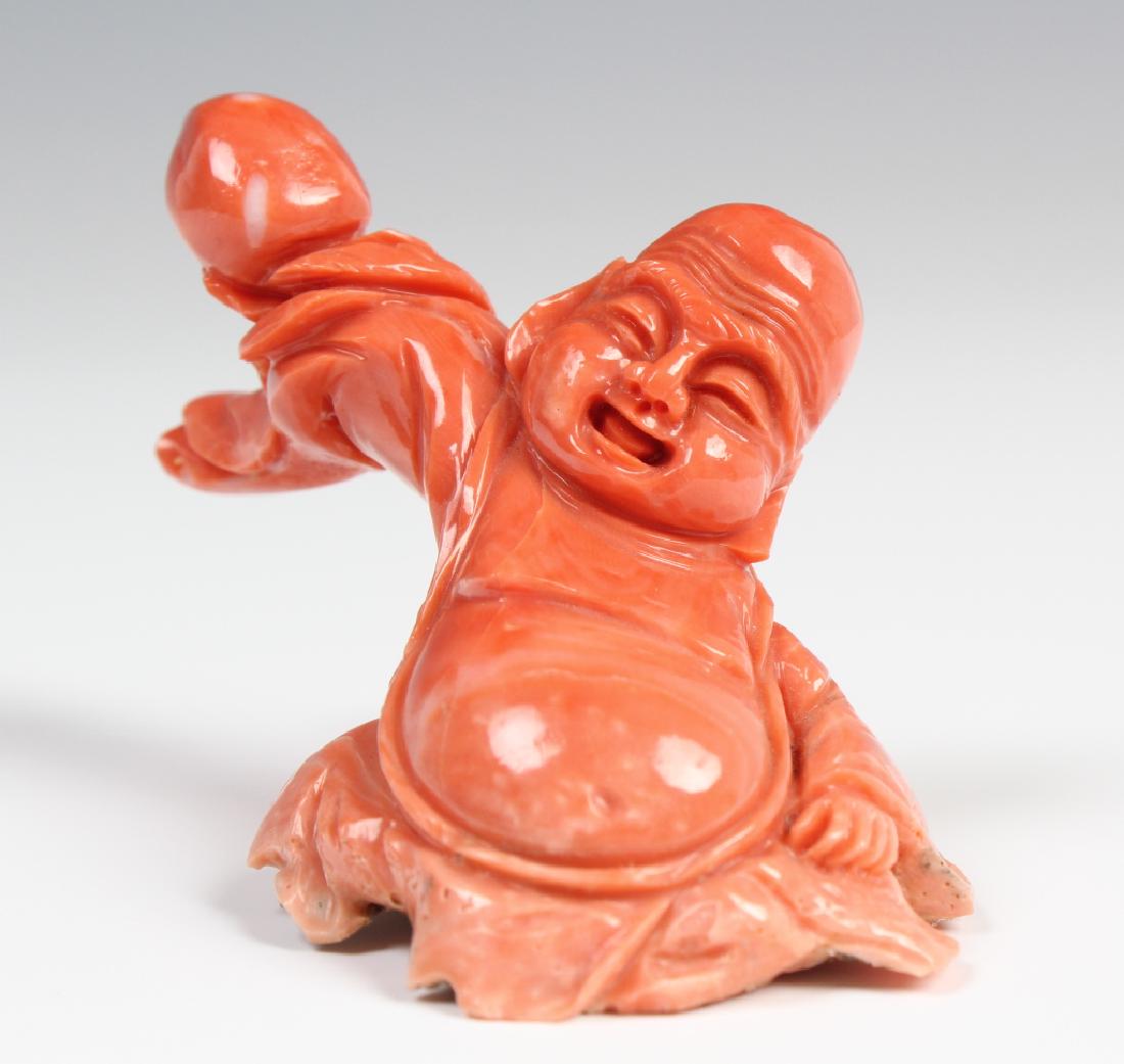 Chinese Carved Natural Salmon Red Coral Buddha 87g: Fine antique Chinese carved natural salmon red pink branch coral Buddha figurine. Depicts the statue form of Buddha , Buddah or Happy Hotei crafted from natural coral. Sculpture measures 2 1/2" x 3".