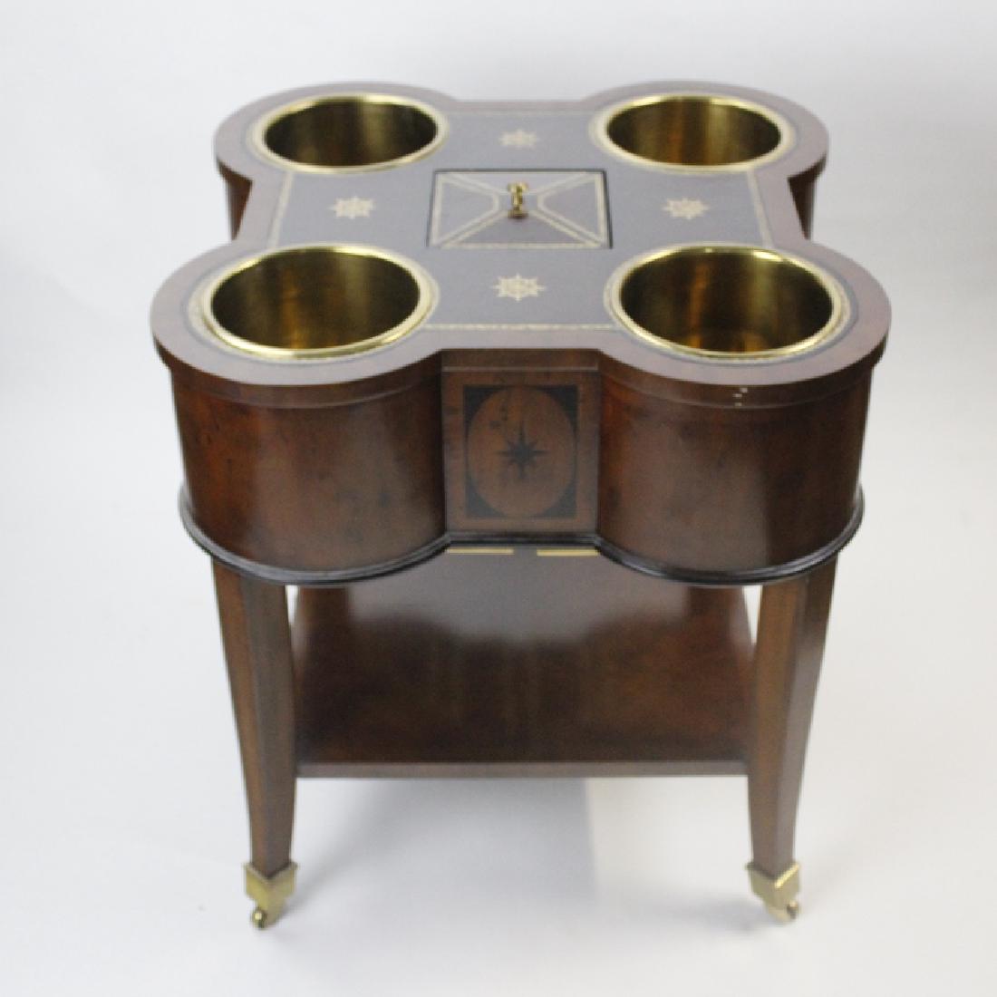 Maitland Smith Bar Wine Tasting Occasional Table: Bar or wine tasting cart by Maitland Smith. Mahogany finish with gold gilt tooled leather insert top. Features four brass insert liner champagne or wine bucket corners. Center fitted with square ice b