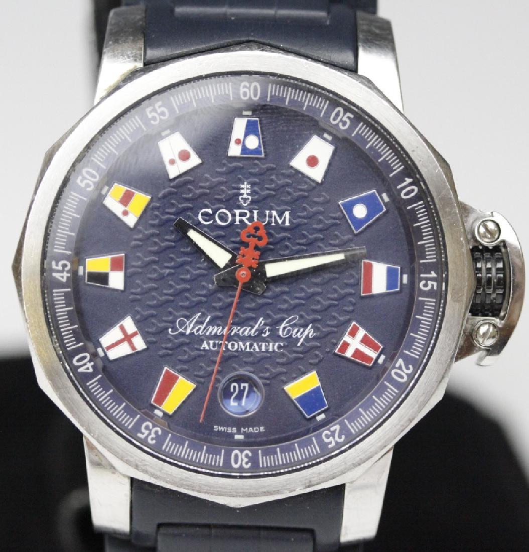 Corum Admiral's Cup Automatic Watch 082.833.20: Working Corum Admiral's Cup stainless steel watch. Reference 082.833.20. Features a steel case housing an automatic movement with blue dial and rubber strap. Dial decorated with nautical flags. Case m