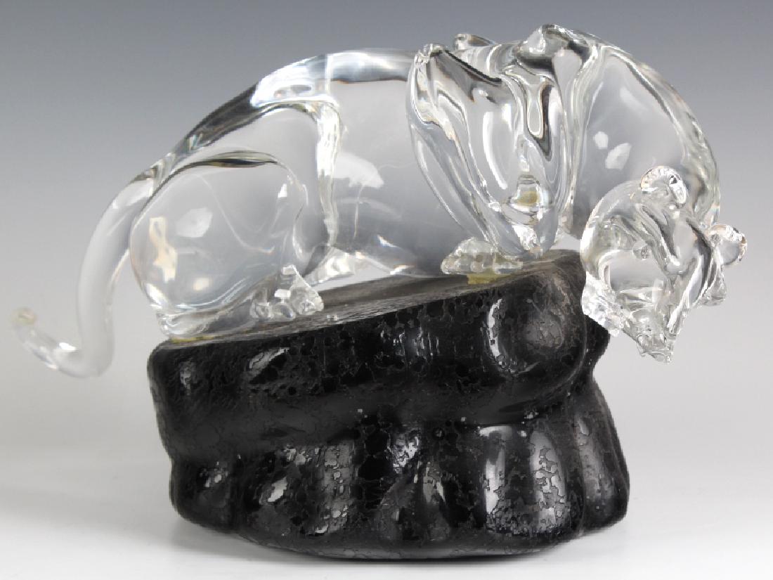 Pino Signoretto b.1944 Glass Art Panther Sculpture: Pino Signoretto (born 1944) Italian. Clear glass art figure mounted to textured black rock base . Sculpture features a crouching clear glass panther resting upon a black rock base. Statue signed on ba