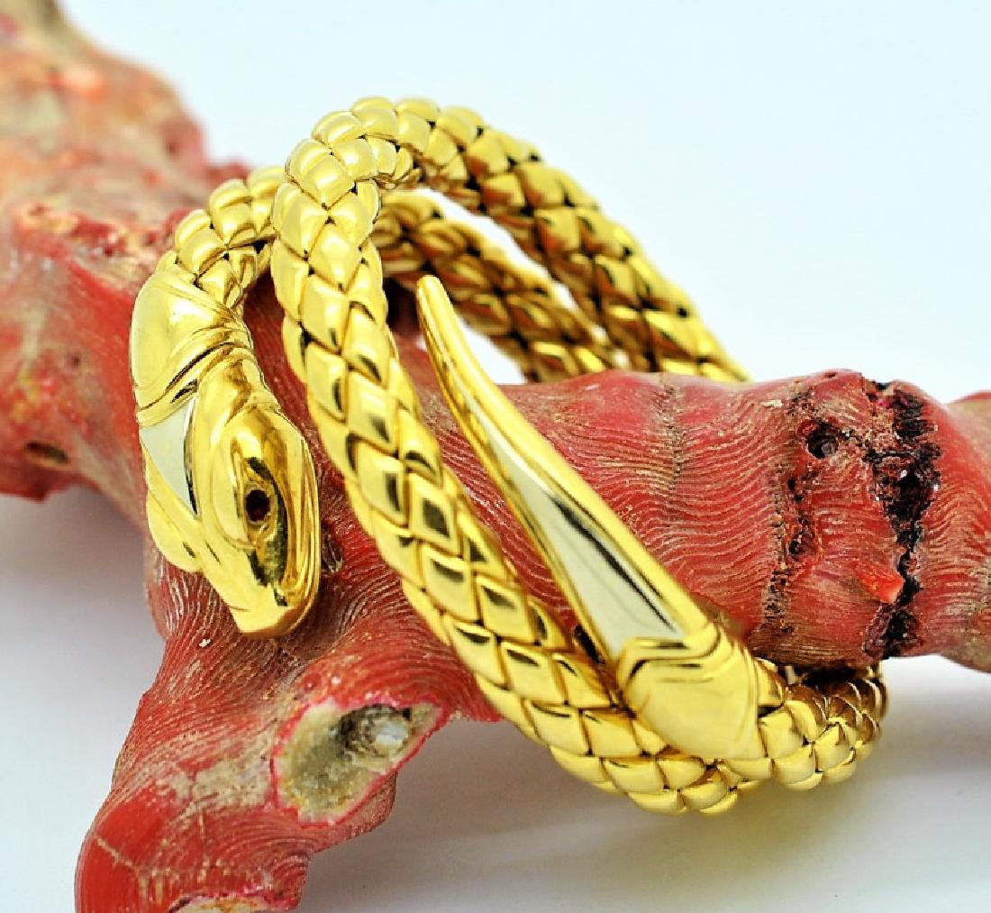 Chimento 18K Gold Ruby Snake Coil Bracelet 93gr. SIGNED: Guaranteed Authentic. Designer signed Chimento 18k gold snake form ruby bracelet. Features a coiled snake form design with diamond shaped 'scales'. One end is capped with the snakes head embellished w