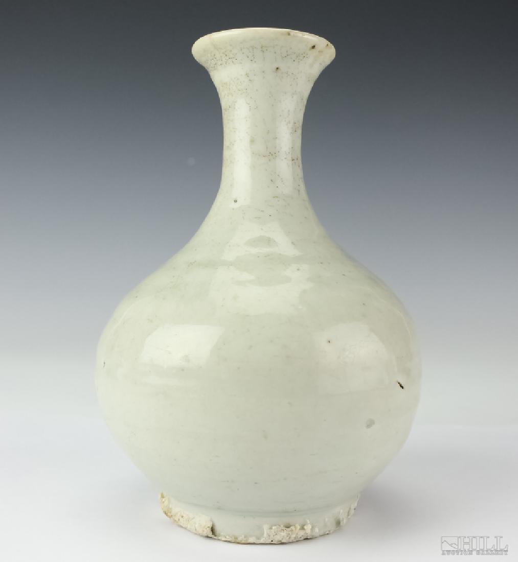 Korean 18C White Porcelain Wine Bottle BASS MUSEUM: Antique Korean 18th Century white porcelain glazed wine bottle. Having bulbous form with long neck. Good condition with signs of age. Measures 4" x 6 3/8". Deaccession # 1990.004.013. Deaccessioned fr