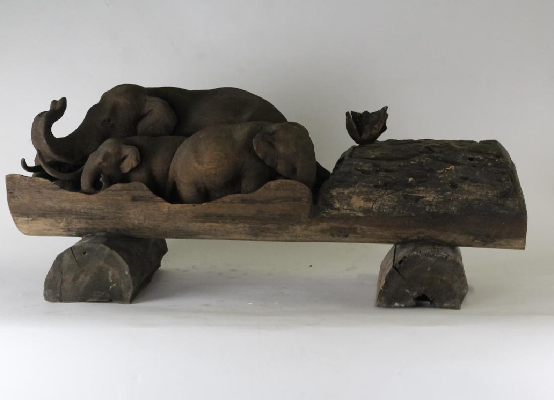 Japanese Meiji Elephant Family Wood Log Sculpture: Antique Japanese Meiji period hand carved solid log sculpture. Depicts a family of elephants in great detail. Hinged box carved end. Measures 14" x 35" x 11" Good condition with mild wear and surface 