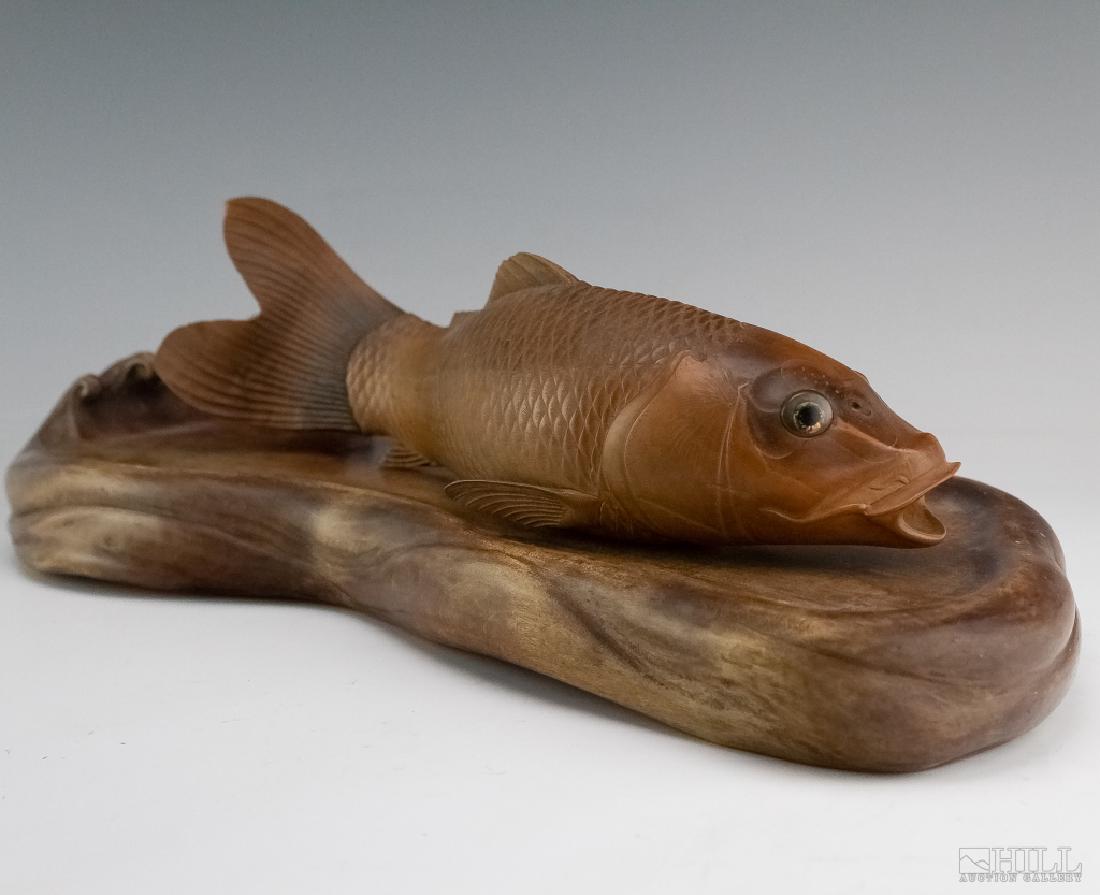 Japanese Meiji 15" Carved Wood Carp Fish Sculpture: Antique Japanese Meiji period hand carved wood fish sculpture. Depicts an carp fish with great attention to detail. Inlaid glass eyes with gold interior. Japanese character artist signature on bottom.