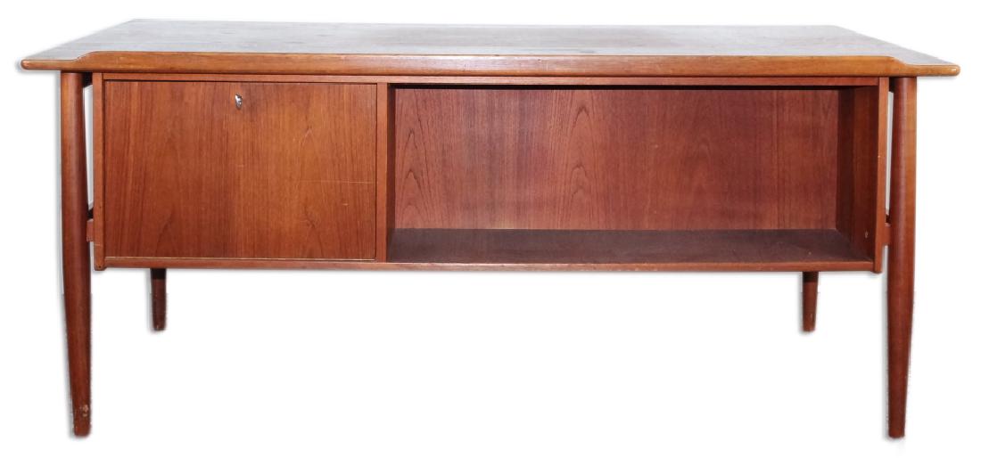 Vintage Danish Modern Style Walnut Executive Desk: Mid century modern executive desk in the style of Arne Vodder. Features three drawers on left with larger file drawer on right. Opposing side fitted with display shelf and locking liquor cocktail cabi
