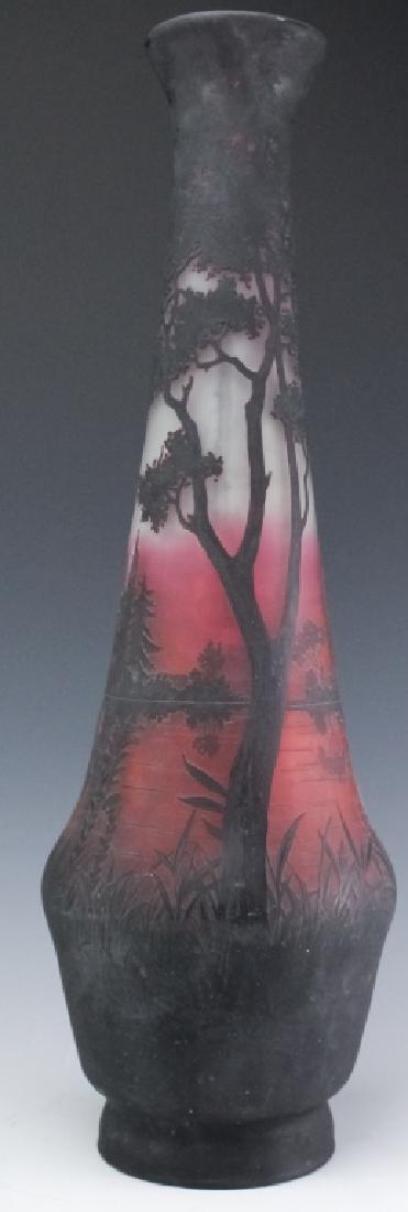 French Style Cameo Etched Glass Landscape Vase: Vintage French style cameo etched glass landscape floor vase. Features cranberry glass with darker purple cased glass acid cut to reveal a lovely lakeside landscape design. Spurious Daum Nancy signatu