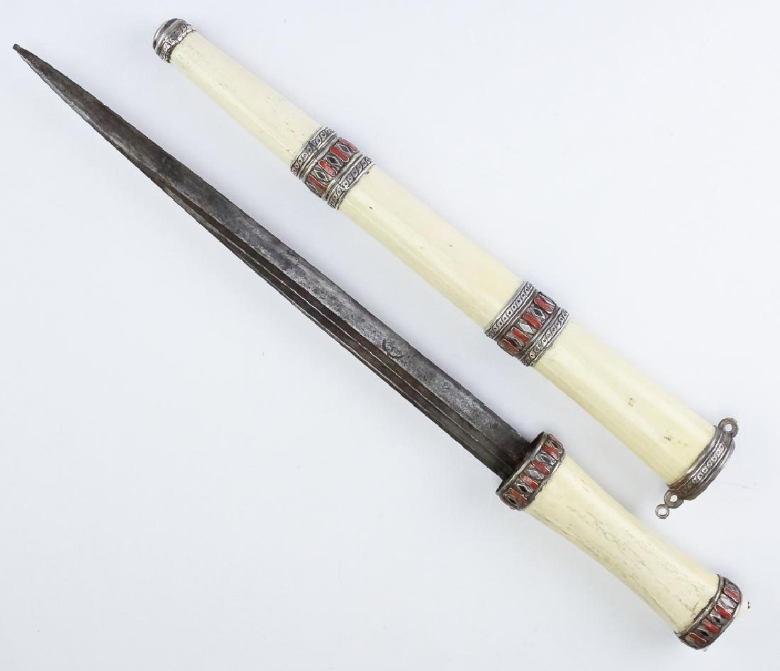 Persian Bone Sword Dagger w Silver Red Coral Inlay: Antique dagger with coral inlay. Features a bone handled dagger with 13 1/2" long blade with unidentified makers stamp. The sheath is crafted of bone with silver and white metal mounts. Embellished wi