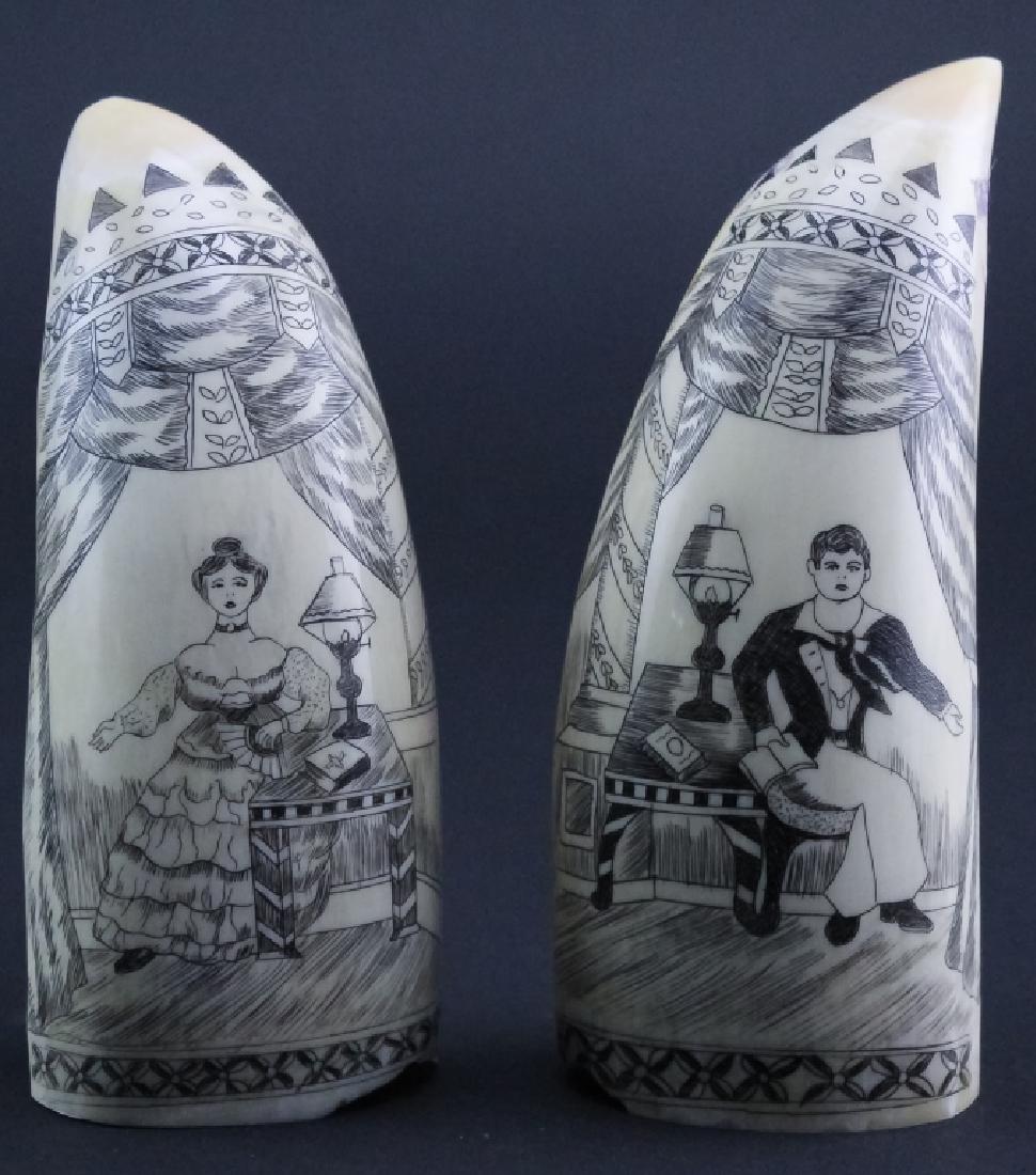 Pr Scrimshaw Carved Man & Woman Whales Tooth: Pair of vintage carved scrimshaw whales tooth. Features the image of a man and woman, surrounded by elaborate drapery. Measures 4 3/4" x 2". Good overall condition with age related wear. Hill Auction 