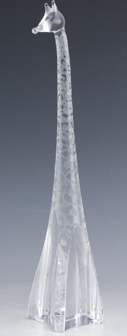 Kosta Vicke Lindstrand Crystal Giraffe Figurine: Guaranteed Authentic. Vicke Lindstrand for Kosta crystal figurine. Features the modernist form of a giraffe with etched decoration. Measures 11 1/2" x 2 1/4" x 2 1/4". Signed on base. Good overall con