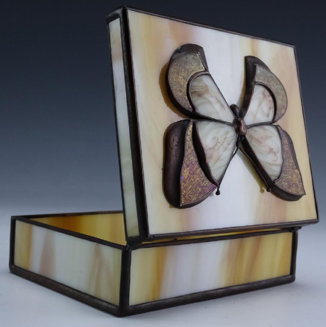Daniel Boone Studio Slag & Aurene Art Glass Box: Guaranteed Authentic. Artisan signed Daniel Boone studio art glass butterfly box. Features copper cames or "calmes" with caramel and milk colored slag glass panels and an applied butterfly crafted of 