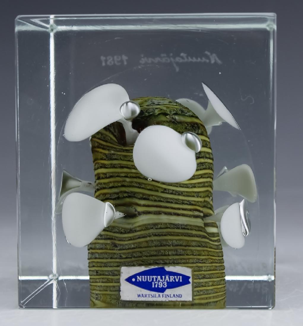 Nuutajarvi Oiva Toikka Art Glass Cube Sculpture: Guaranteed Authentic. Rare Nuutajarvi annual cube Paperweight. Features a modernist and abstract sculpture by Oiva Toikka with a mushroom fungus like tree cased in clear glass. Comes with original cer