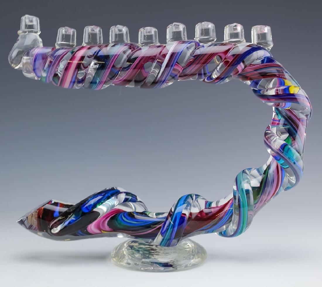 David Goldhagen Studio Art Glass Menorah Judaica: Guaranteed Authentic. David Goldhagen studio art glass Hanukkah Menorah. Features a crescent formed cane of glass with swirls of colors including pink, red, blue, green, all topped with 9 sections for