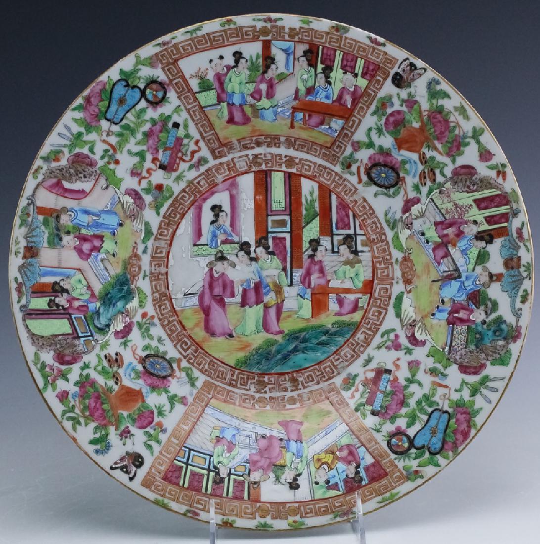 Chinese Rose Mandarin Porcelain Charger Plate 13": Crafted of fine quality Chinese porcelain. Hand decorated in famille rose colors. Tableware features a central medallion with a woman in the window and others in a courtyard setting. Surrounded by car