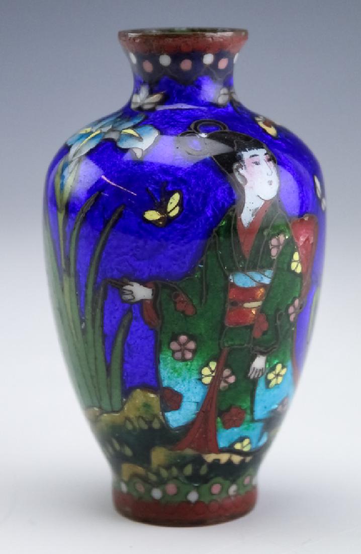 Japanese Fine Wire Cloisonne Figural & Floral Vase: Fine antique fine wire cloisonne enamel over copper vase. This diminutive vase features a geisha with numerous flowers and butterflies flying about all on a cobalt blue ground. Measures 3 1/4" x 2 1/4