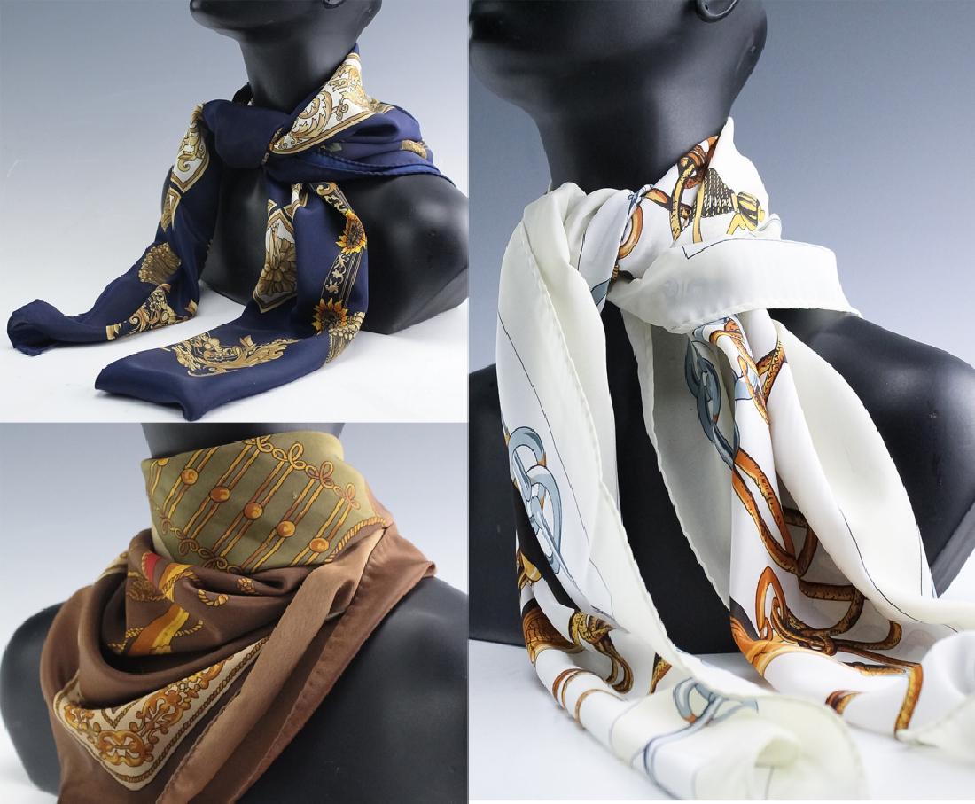 LOT 3 Hermes Paris French Silk Scarves AUTHENTIC: Collection of three Hermes Paris silk scarves. Each features a hand rolled edge. Features one with drums and trumpets on a brown ground and measures 34" x 34". The second features horse bits and golde