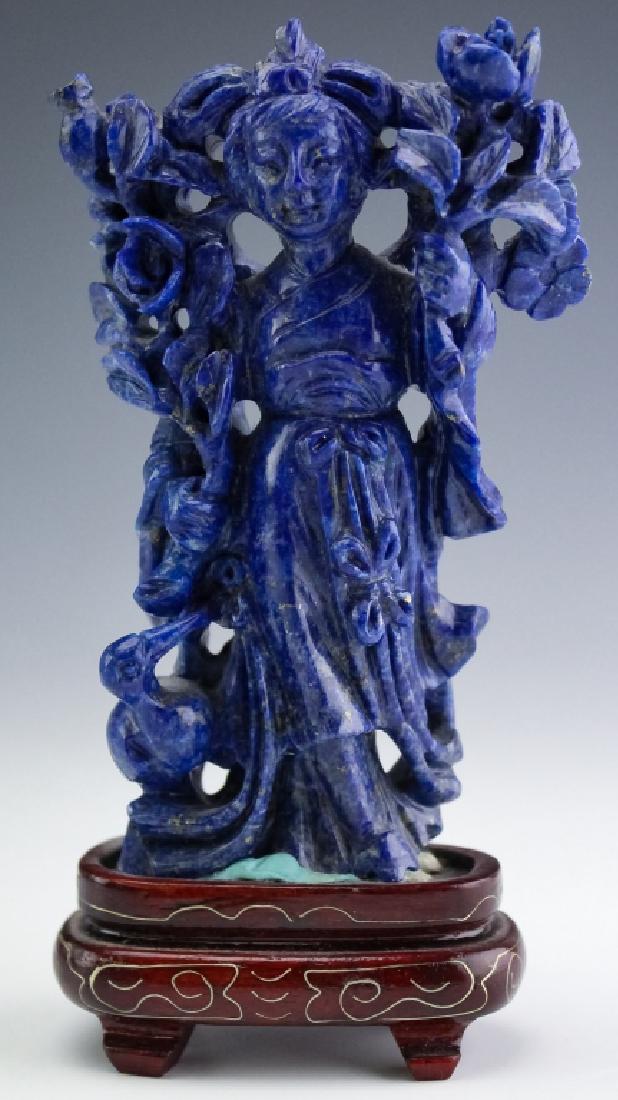 Chinese Carved Blue Lapis Lazuli Quan Yin Figurine: Vintage carved Chinese Lapis Lazuli figurine of Quan (KWAN) Yin. Well carved figure out of a gorgeous piece of Lapis with veining and speckles. Comes with an associated wooden stand. Figurine Measures