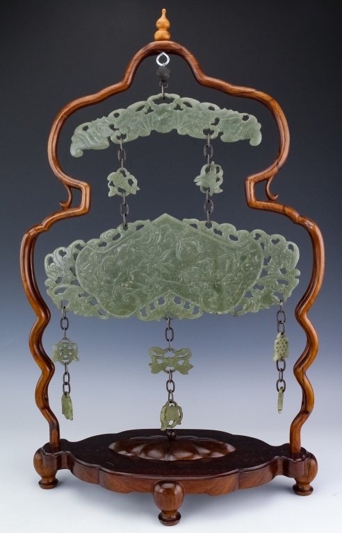 Old Chinese Reticulated Carved Green Jade Panel: Old Chinese carved green jade panel. Carving features a series of green jade panels with the largest depicting various auspicious symbols including plumbs, a crane, and bats. The top panel is in the f