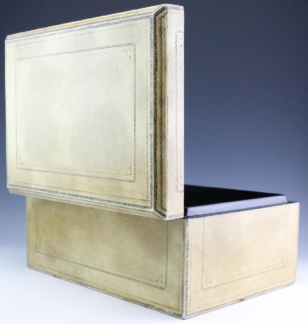 Maitland Smith Antiqued White Tooled Leather Box: Large document box in the style of Maitland Smith. Well constructed with tooled leather surface finished in antiqued white. Black lacquer finished interior. Made in Philippines label on bottom. Measur