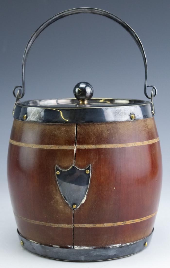 Mappin & Webb Silver Plate Wood Barrel Ice Bucket: Vintage wood and silver plated ice bucket with porcelain liner. Features a wood barrel form body with silver plated metal mounts. The lid opens to reveal a porcelain lined interior for ice. Marked Map