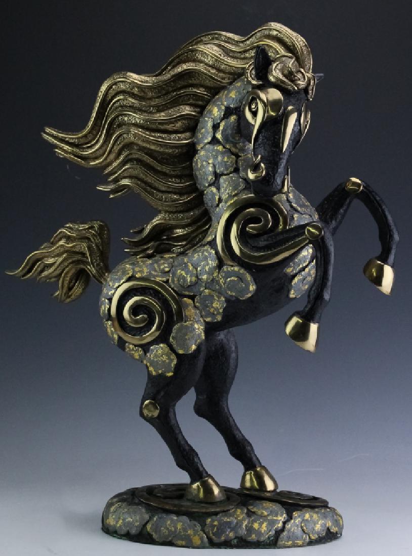 Tiefeng Jiang b1938 China Gilt Bronze Horse Statue: Guaranteed Authentic. Signed limited edition bronze statue by Tiefeng Jiang (1938- China / Minnesota) Sculpture depicts a rearing black horse with blowing mane and tale. Gold and silver gilt cloud for