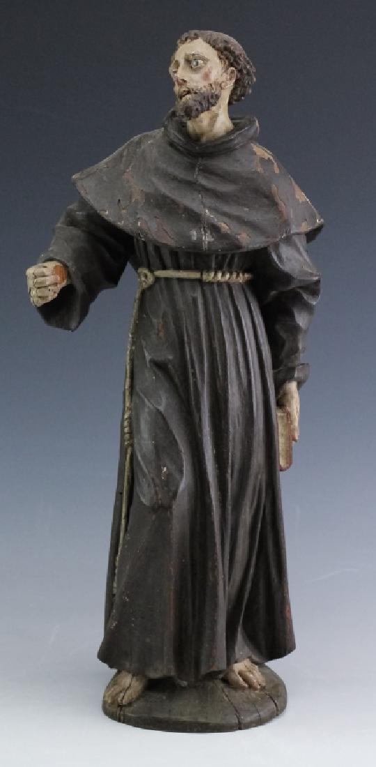 Antique H-Carved & Painted Wood Monk Santos Statue: Antique hand carved and painted religious Santos monk in Latin American Catholic style. Depicts a monk with brown robe and tonsured head. Inlaid glass eyes. His hands hold a book and appear to have ha