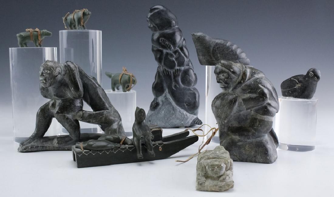Alaskan Inuit Carved Stone Figural Art Sculptures: Mixed lot of 7 artisan signed and unsigned sculptures. Features a collection with figural and animal forms including an Eskimo with seal, a dog sled and rider with dogs, and nude figure, and other for