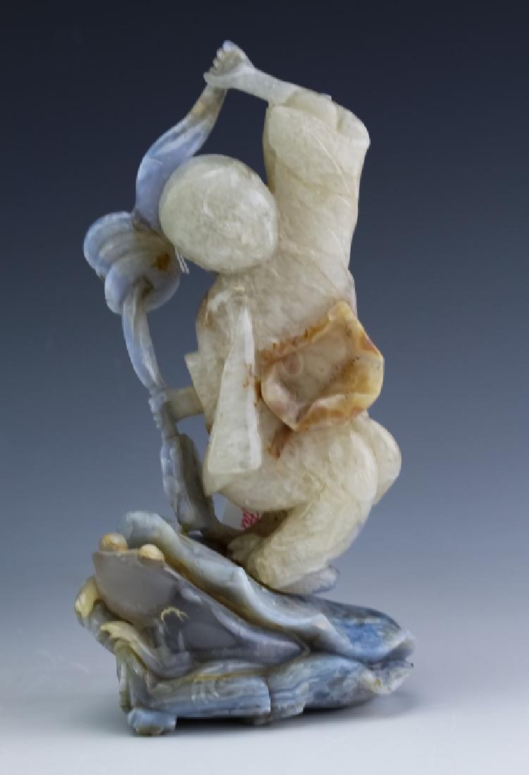 Chinese Blue Banded Agate Carved Wise Man Statue: Old Chinese export carved banded agate wise man sculpture. Figure features the form of a wise man with a ribbon of three coins. Mounted to base featuring a carved frog or toad motif. No found markings