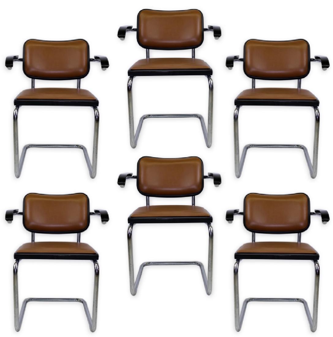 6 Marcel Breuer For Knoll Leather Dining Armchairs: Set of six Knoll dining chairs designed by Marcel Breuer. Features tan leather with black plastic on a tubular steel and chrome frame. 31" x 20" x 23 1/2". Good overall condition with wear from modera