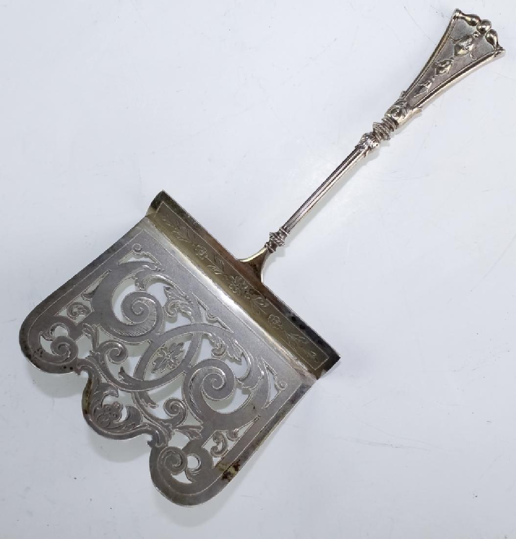 Koch & Bergfeld 800 Silver Hooded Asparagus Server: Koch & Bergfeld .800 fine silver hooded asparagus server. Guaranteed Authentic. Features a scrolled reticulated form with thin handle that tapers and flares at the end with a raised floral motif. Not